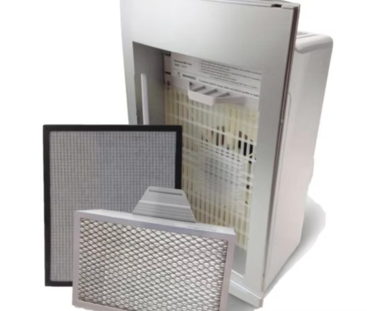 An air purifier with two filters sitting next to it