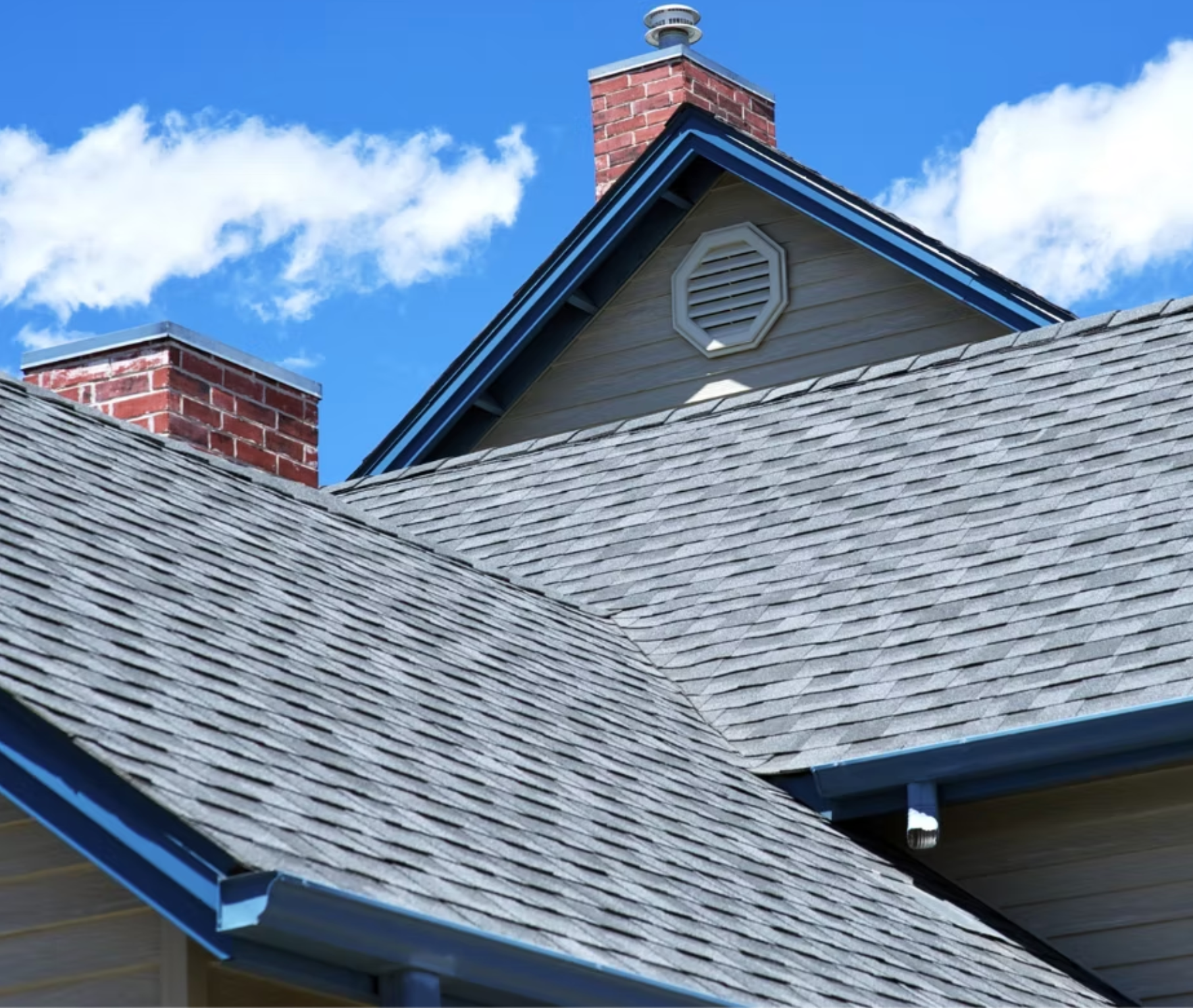 The roof of a house with a chimney on top of it