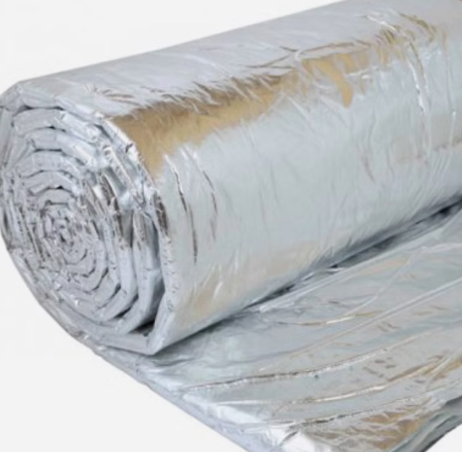 A roll of aluminum foil on a white surface
