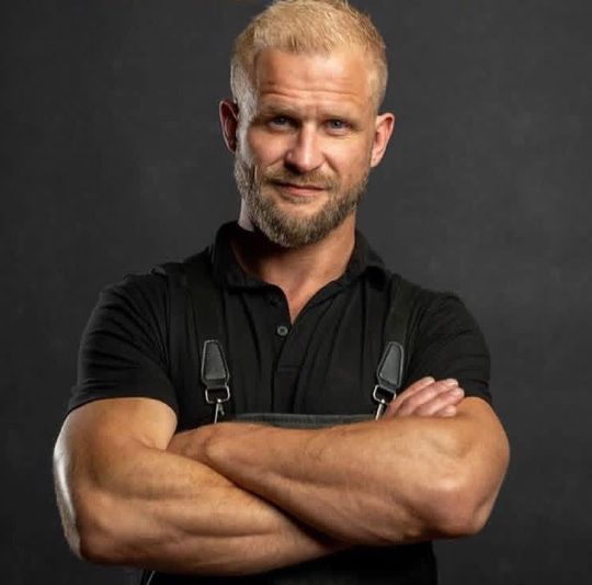 Headshot of Andrew Solberg, a barber at Deluxe Barbershop in CDA