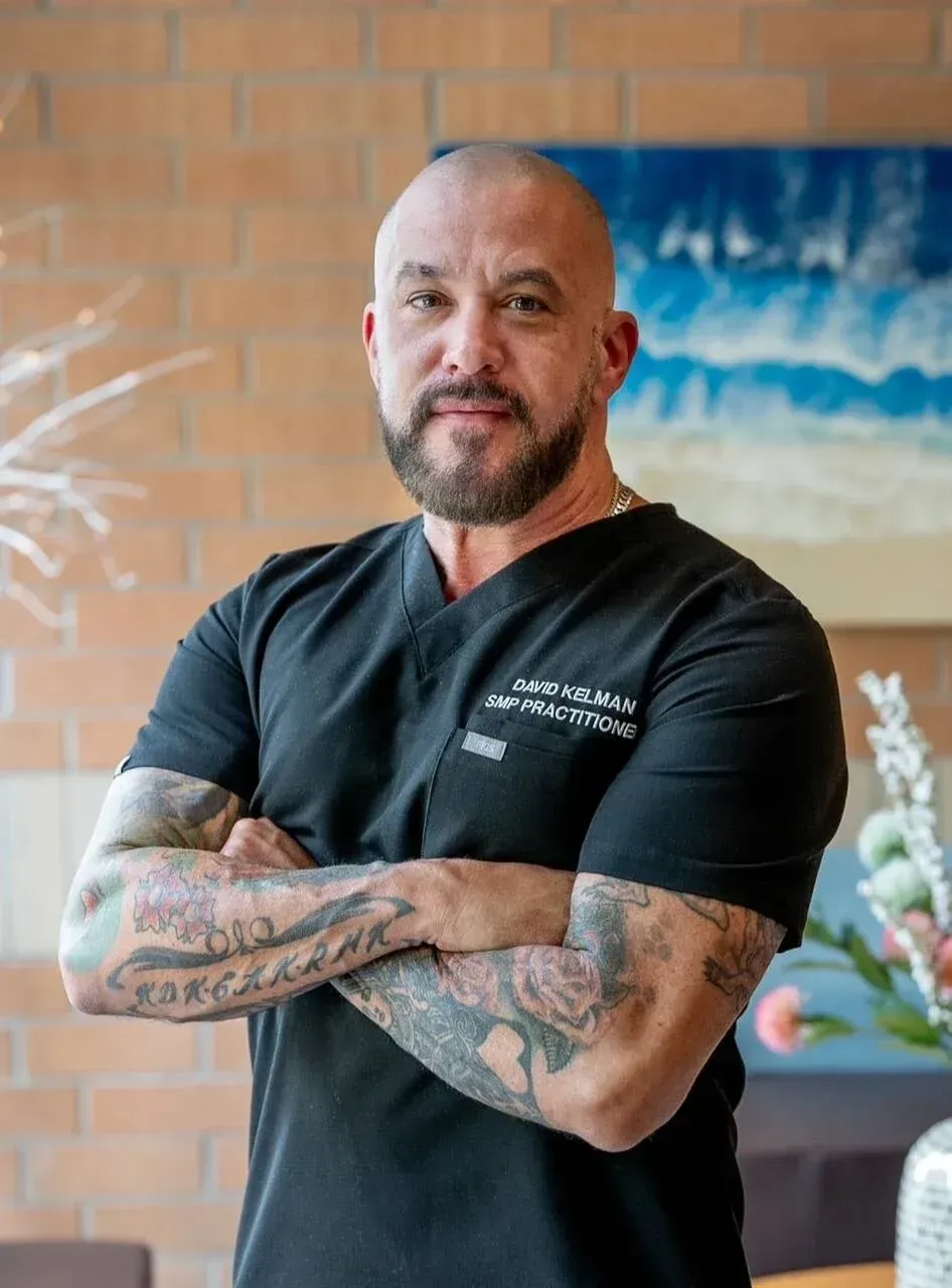 headshot of David Kelman a barber and owner of Deluxe Barbershop