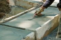 A worker working with concrete offers great concrete prices in Bullhead City, AZ