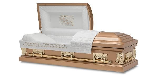 An open, bronze-colored casket with white interior lining and ornate gold handles, ready for a burial.