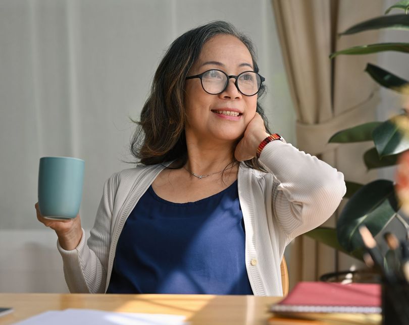 Confident woman enjoying peace of mind after resolving back taxes — Ovation Tax Group story