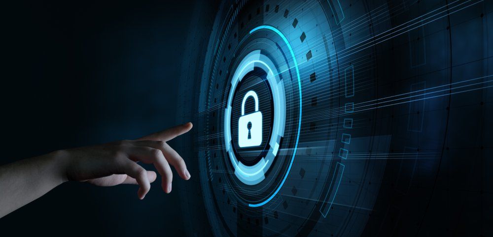 A person is pressing a button with a padlock on it.