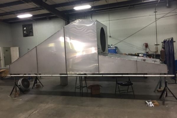 A large piece of metal is sitting in a room.