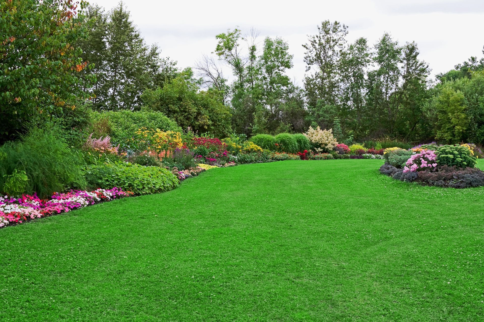 Green lawn (with a bit of clover) in a colourful landscaped formal garden | Omaha NE 