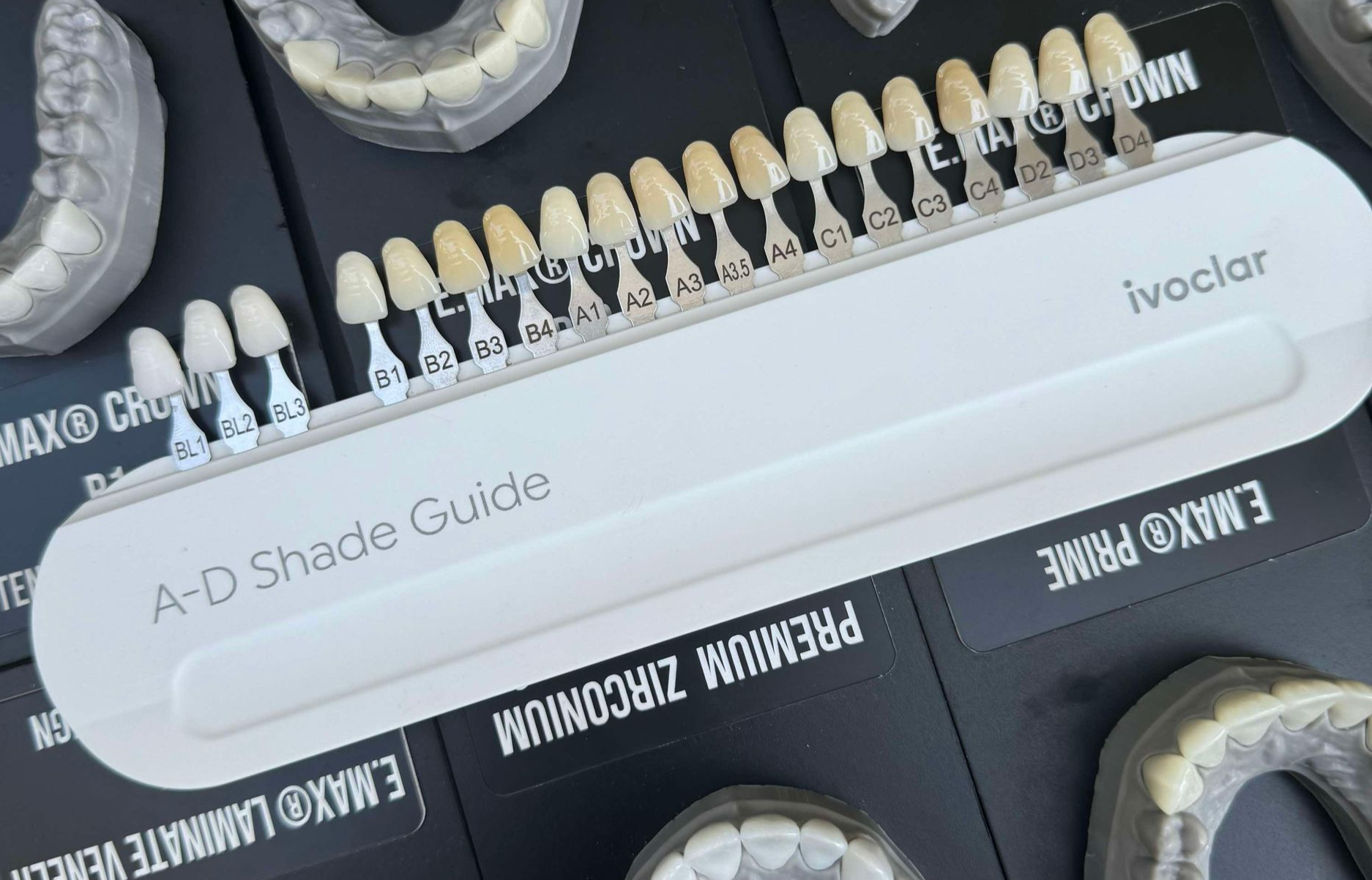 A dentist's shade guide with multiple tooth samples for matching tooth color.