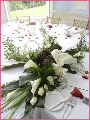 an arrangement of white flowers for a wedding