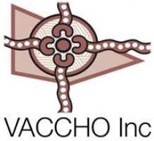 Logo of VACCHO Inc, featuring a brown abstract design with a circle, cross-like elements, and triangle.