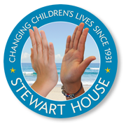 Stewart House logo: two hands raised, blue circle with text 