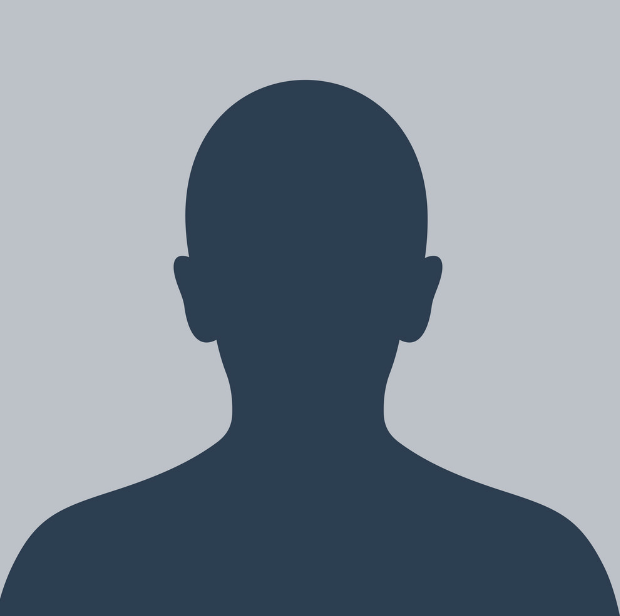 Silhouette of a person against a gray background. Dark blue figure with head, shoulders, and upper chest visible.