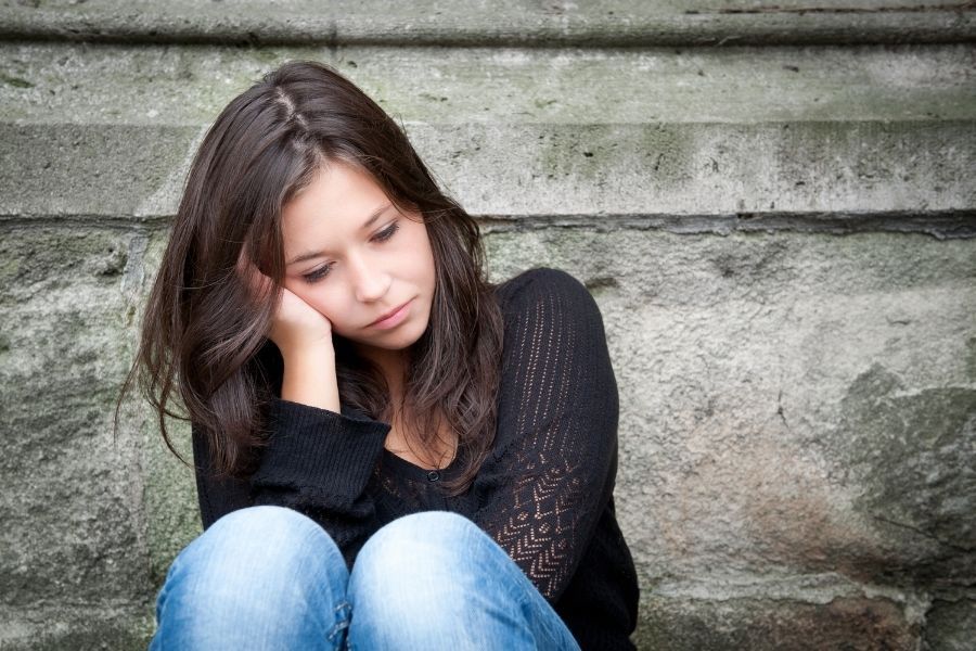 young mom sitting on stairs