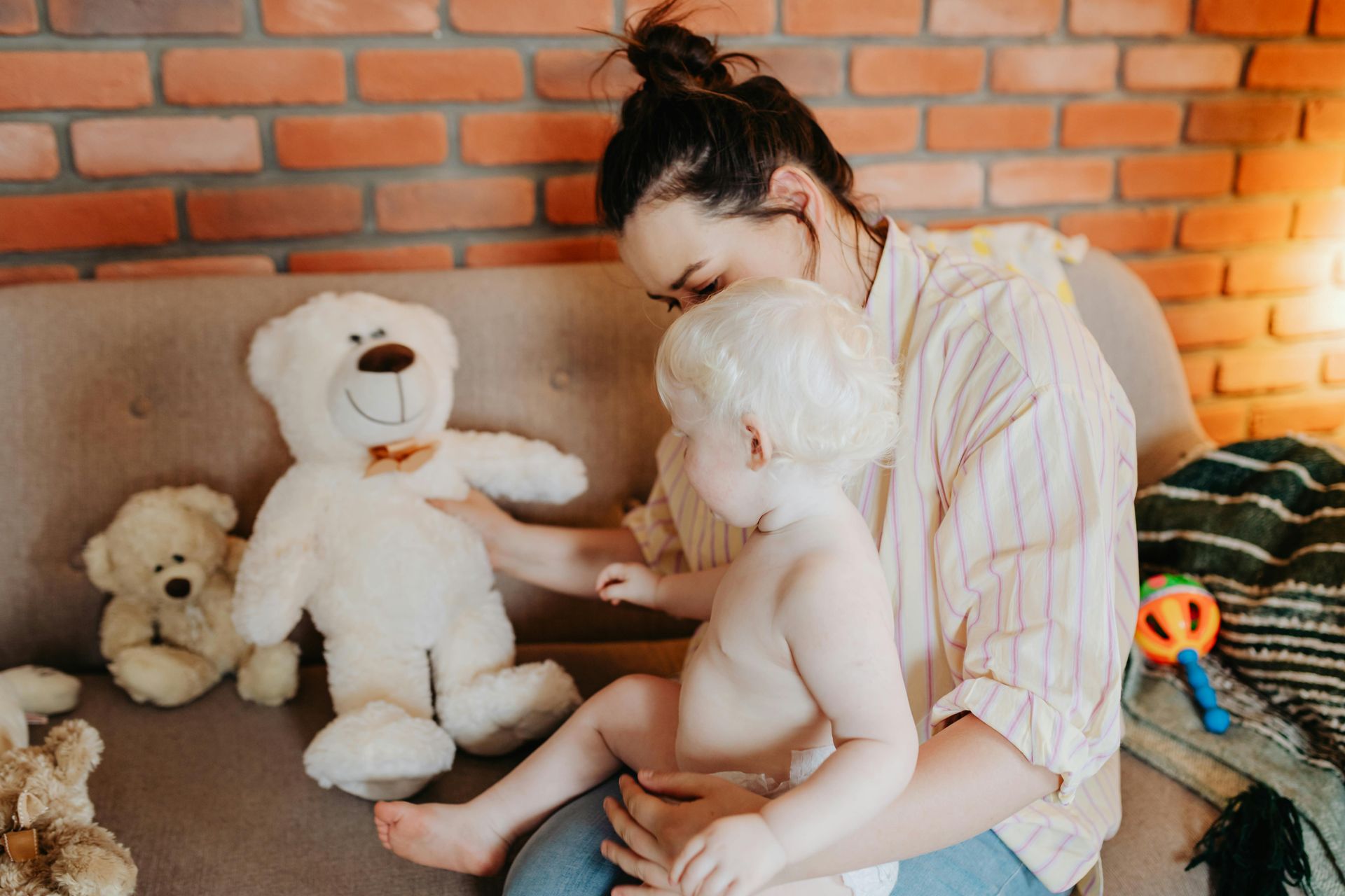 a mom playing with her baby