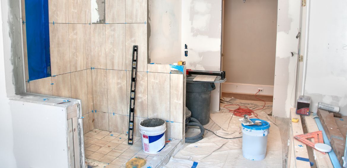 Bathroom under construction, tiled shower are.