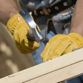 Roofer uses nail gun to secure shingles — Roofing in Maple Shade, NJ