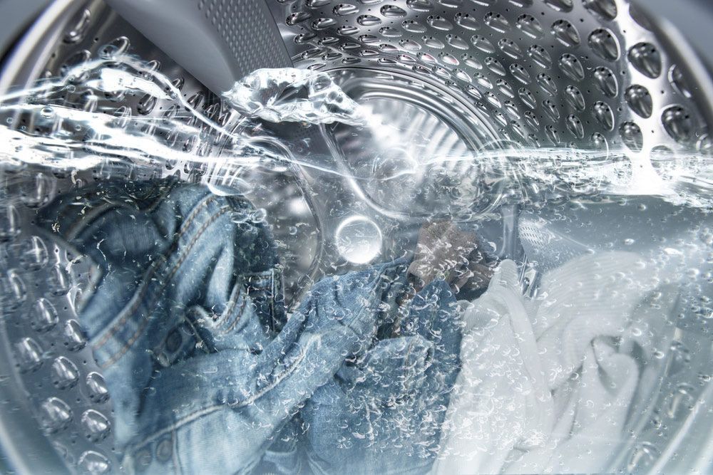 A Washing Machine Is Filled With Water And Clothes Are Being Washed — Buderim Laundrette In Maroochydore, QLD