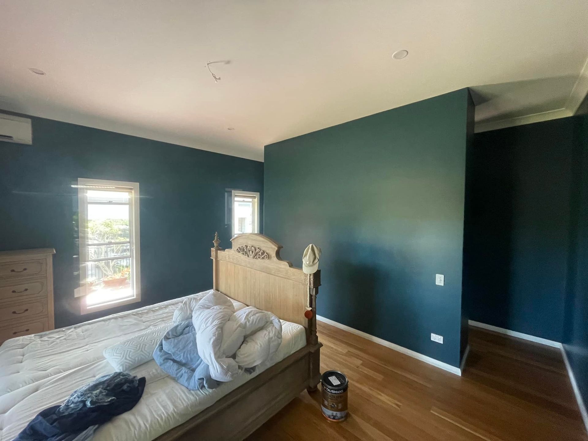 Bedroom with freshly painted green walls - Cornall Painting Services in Wauchope NSW