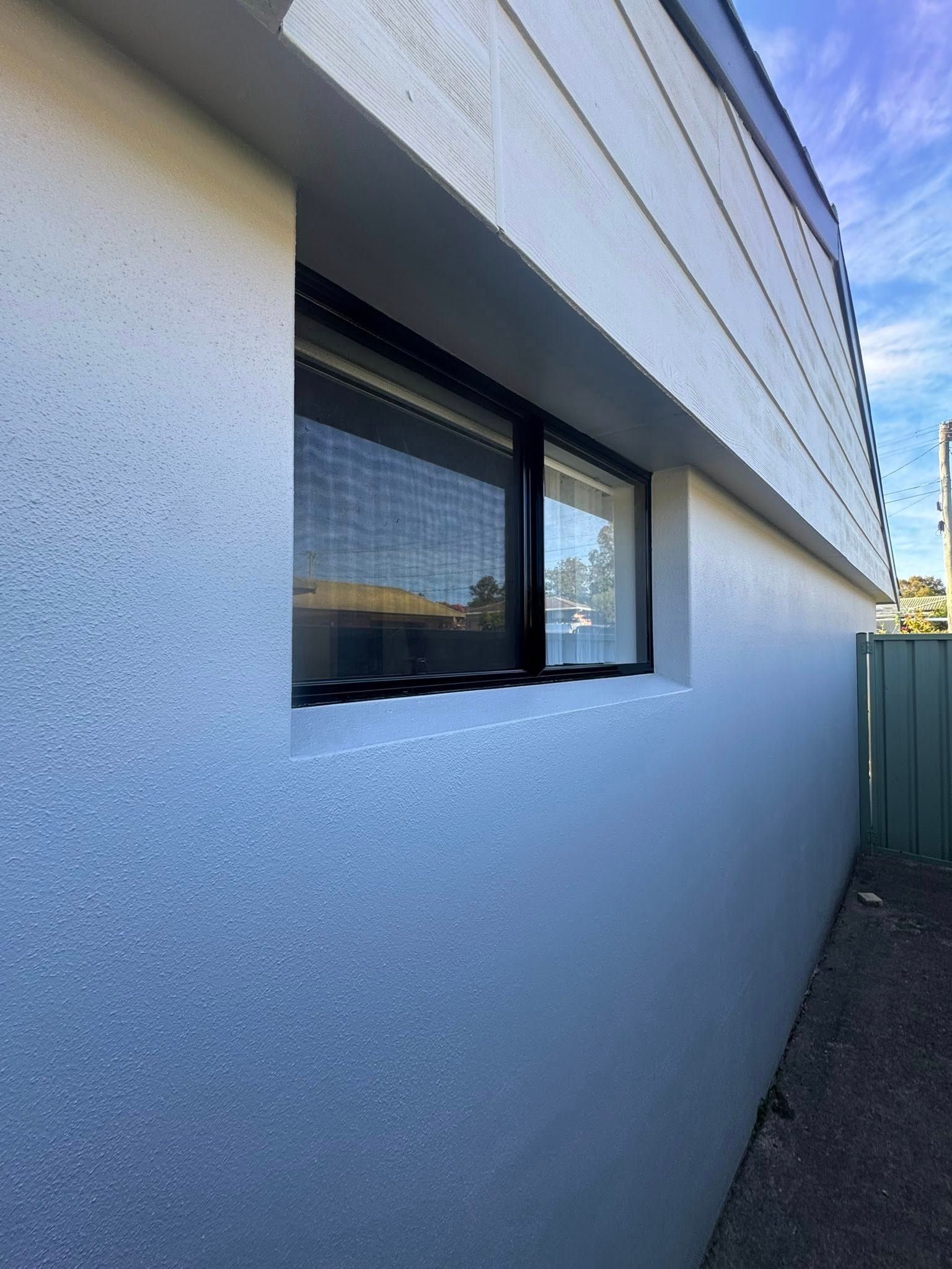 A white side wall of a house - - Cornall Painting Services in Wauchope NSW