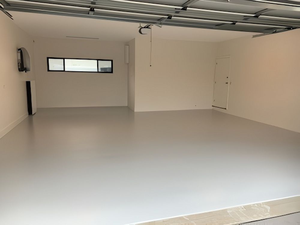 Clean Empty Garage With Fresh Coated Floor — Cornall Painting Services in Wauchope, NSW 