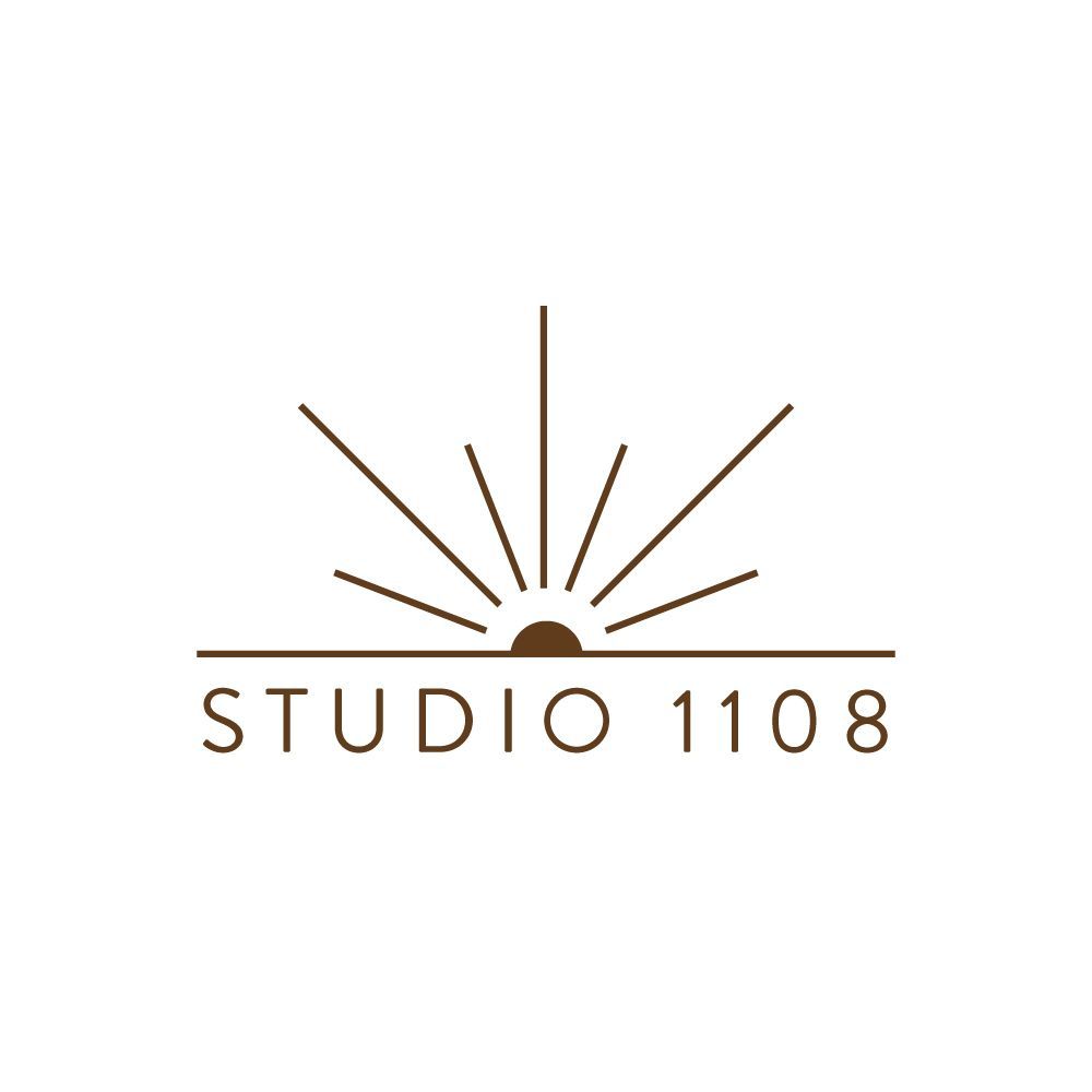 Brown logo: half-circle sunburst above 