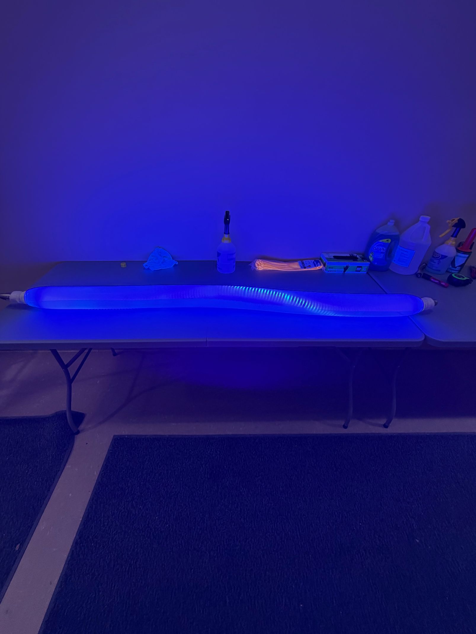 Glowing pipes transporting energy to a house, with machinery in the foreground and a cross-section of underground pipes.