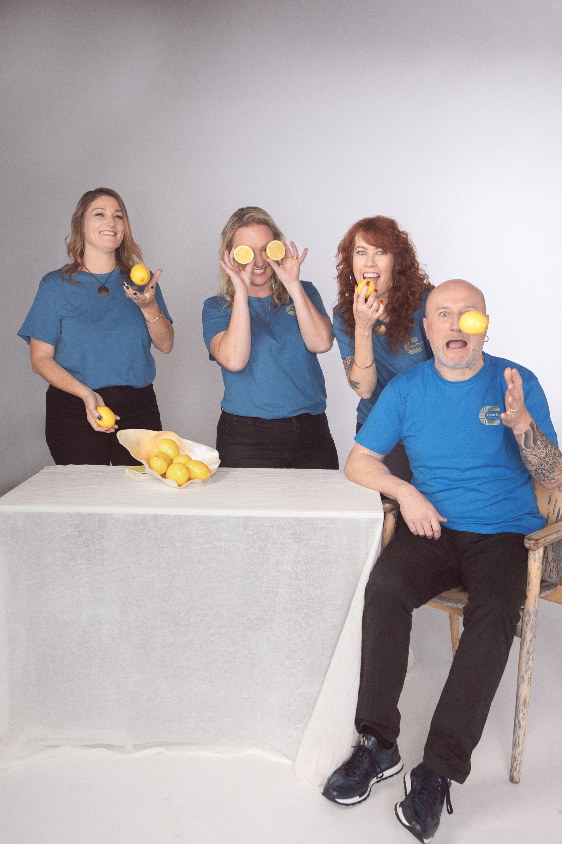 A Man in A Wheelchair Is Giving a High Five to Another Man — Heal Connect in Coffs Harbour, NSW