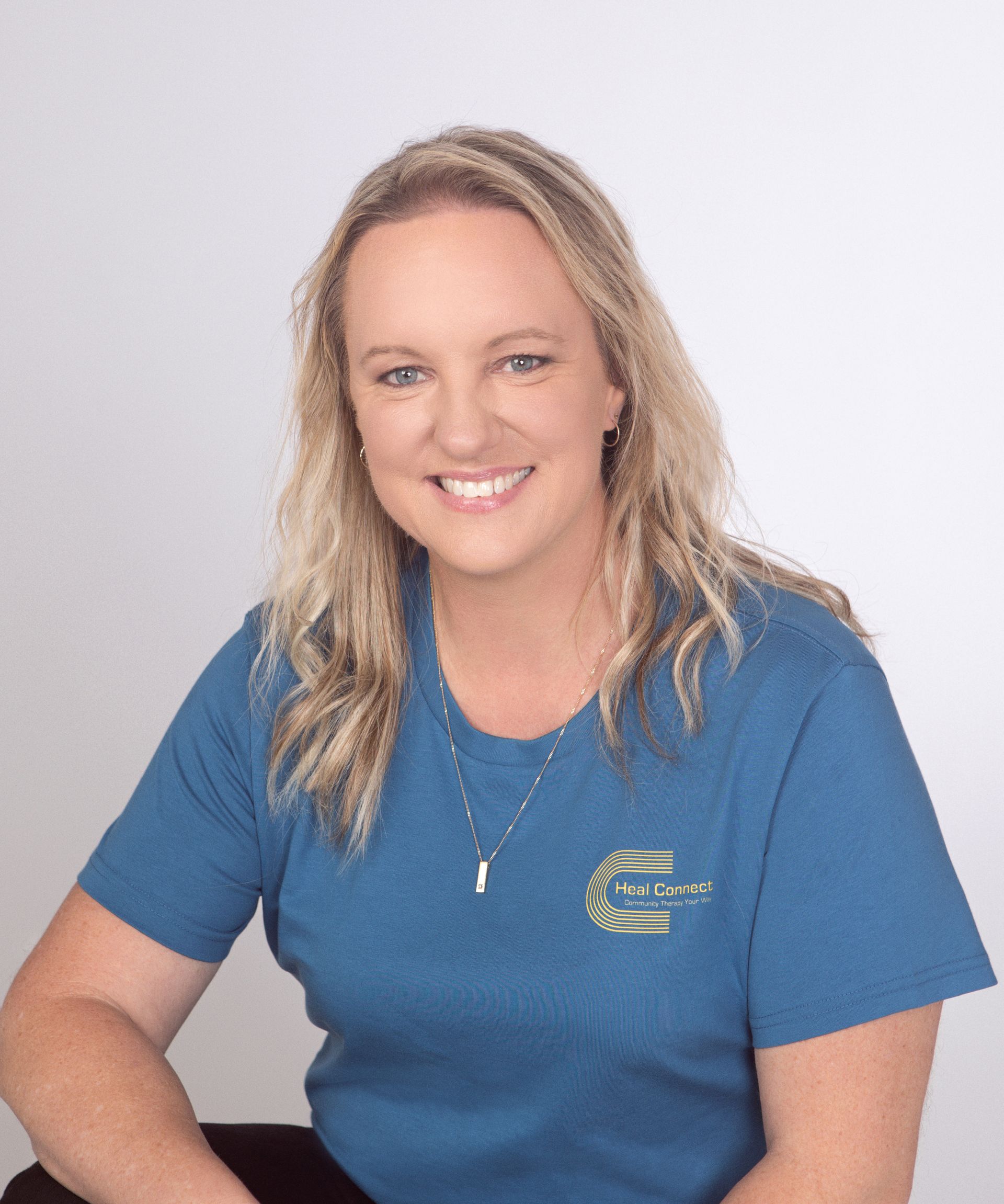 A Disabled Child In A Wheelchair Relaxing Outside With A Care Worker — Heal Connect in Glen Waverley, NSW