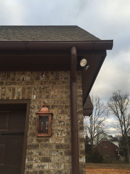 Gutter and downspout on brick home - B & B Roofing in Decatur, AL