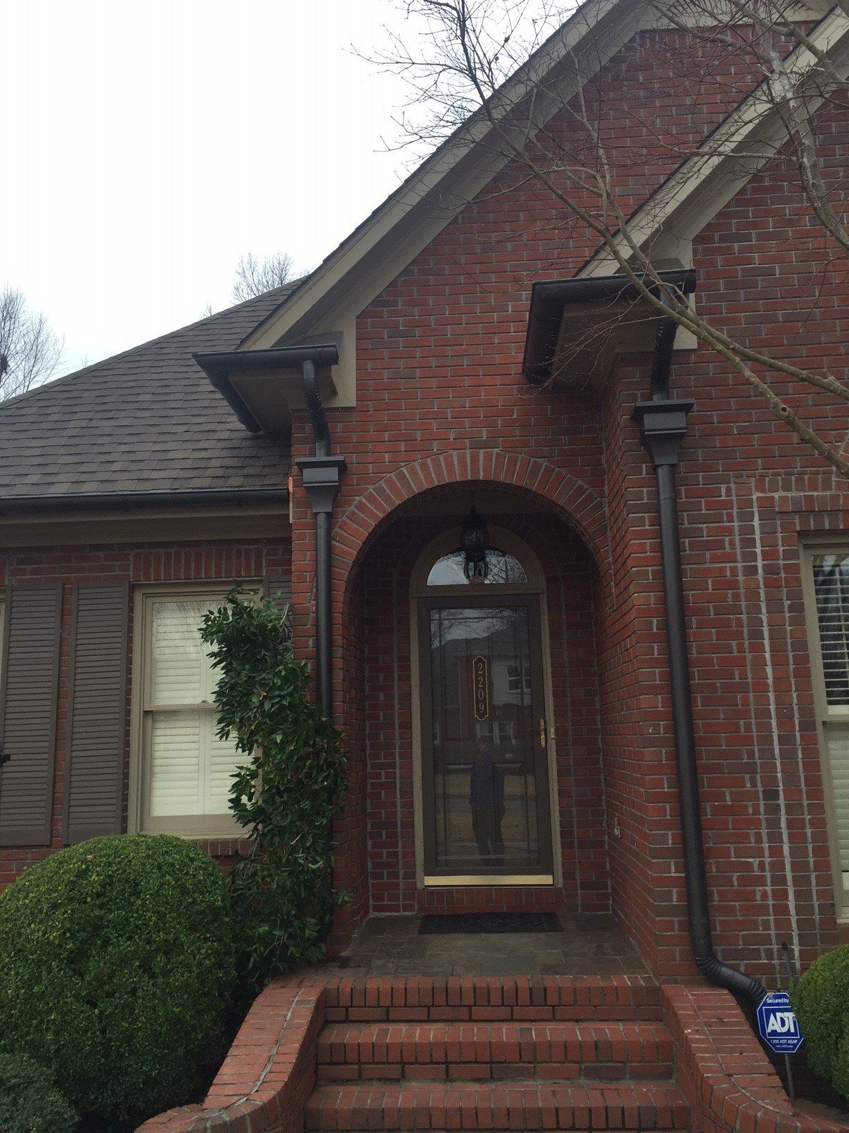 Front entrance to brick home - B & B Roofing in Decatur, AL