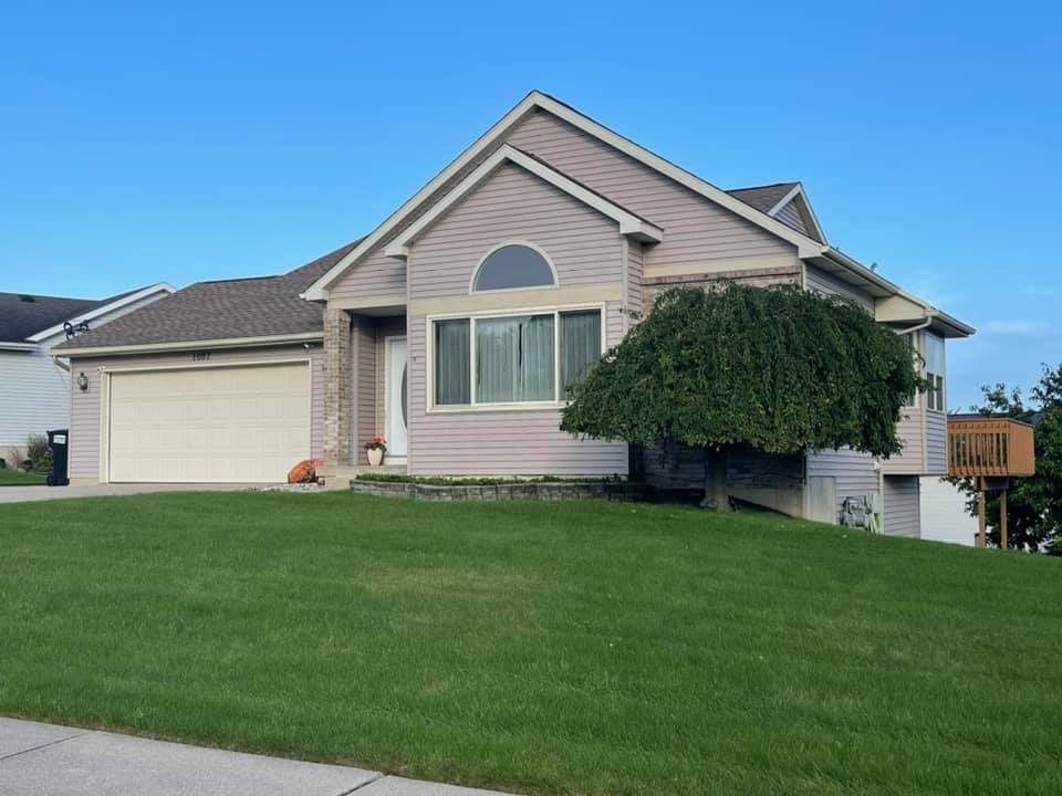 A house with a tree in front of it