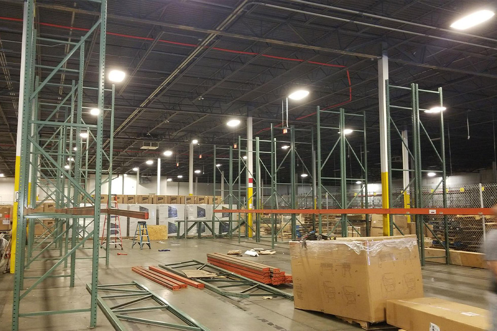 An Electrician Is Working On An Electrical Outlet With A Multimeter