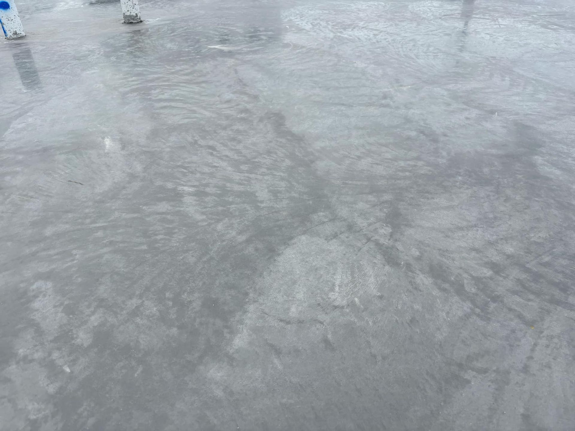 A person is ice skating on a frozen lake.
