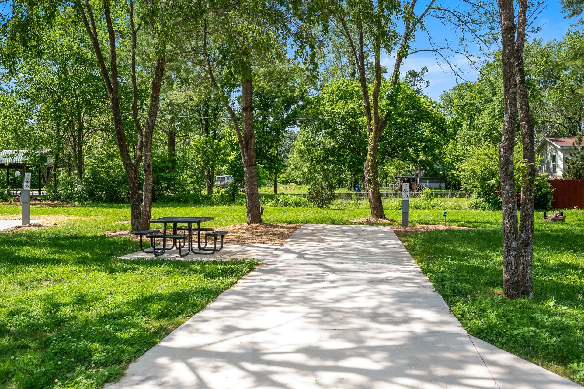 There is a picnic table in the middle of the park.