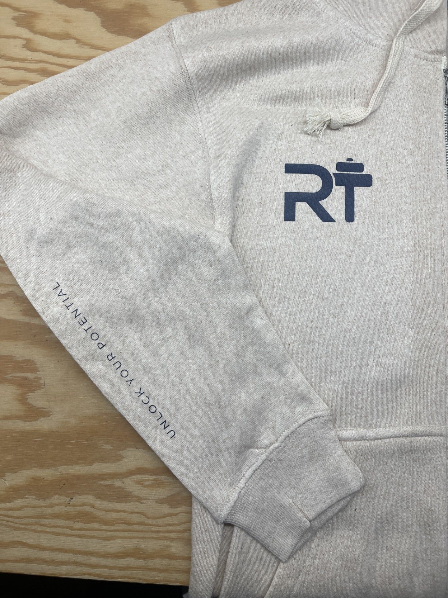 A close up of a hoodie with the word rt on it.