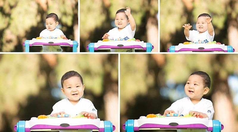 A baby is sitting in a walker and making different faces.