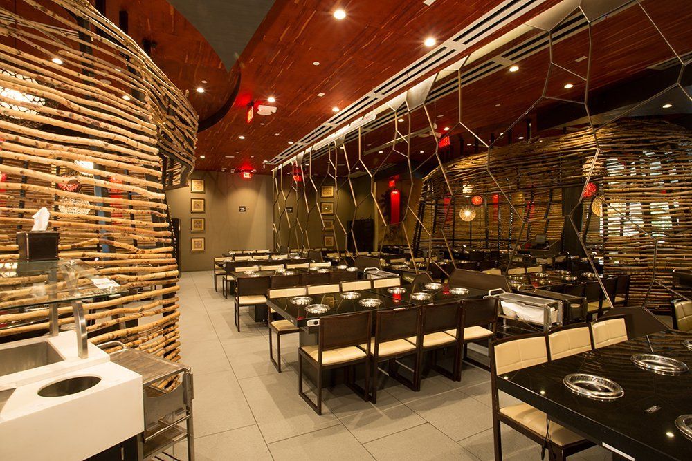 A restaurant with a lot of tables and chairs