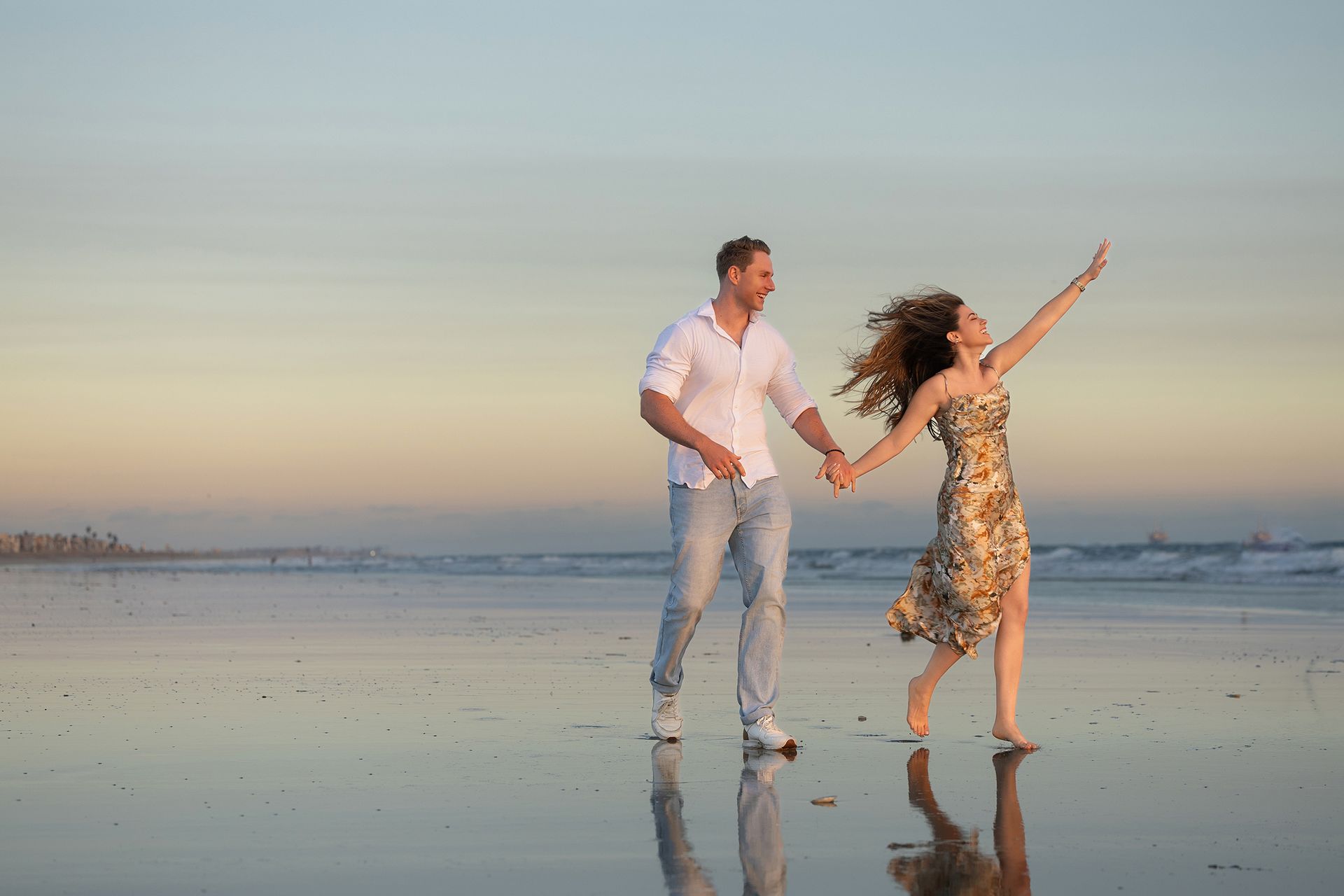 the girl is happy after she receives her  ring on beach