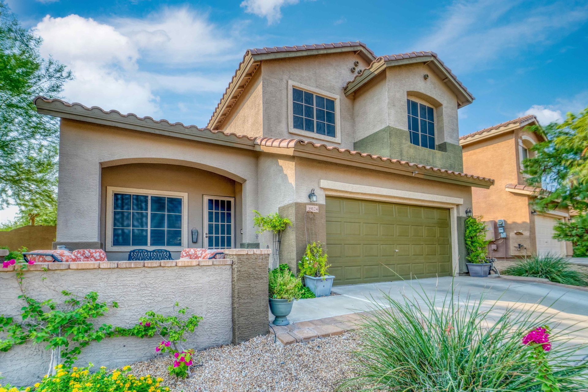 Curb view of a house with a beautiful landscape