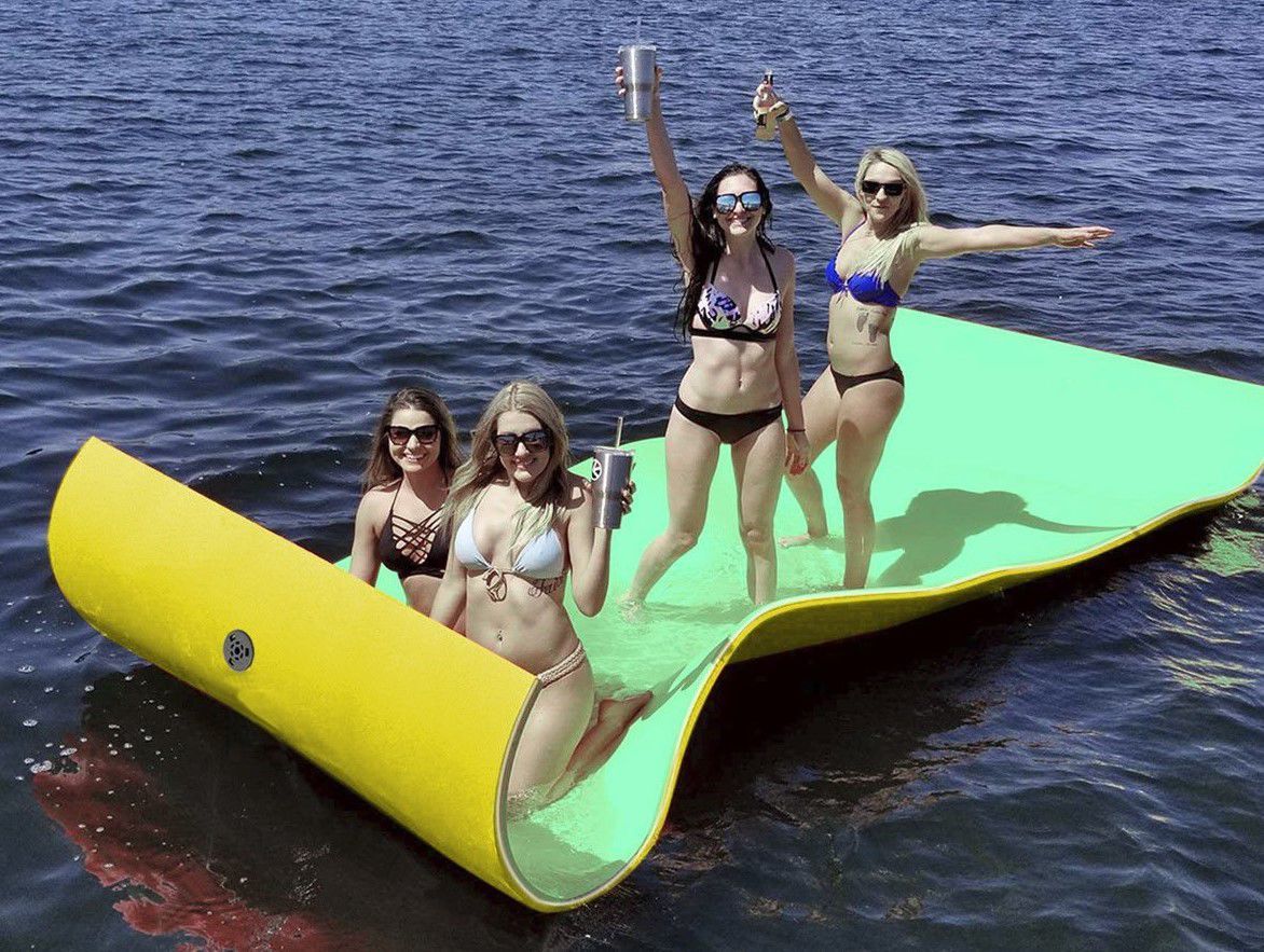 Group of young women on floating water pad