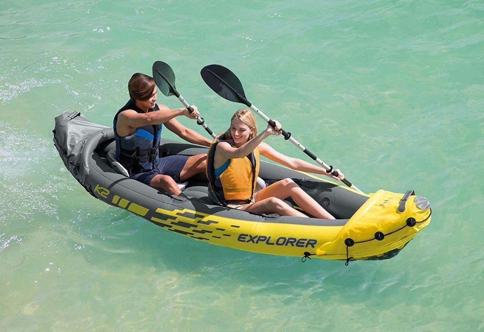 Couple in tandem inflatable kayak