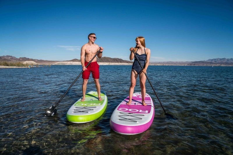 Man and woman on stand-up paddleboards