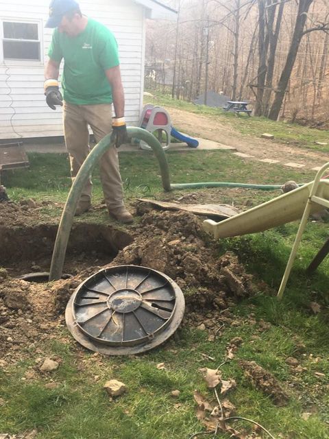 Worker Cleaning the Septic Tank — Mount Nebo, WV — Triple T Septic Service LLC