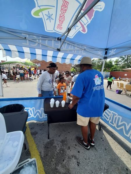 A man wearing a blue shirt that says ' ice cream ' on it