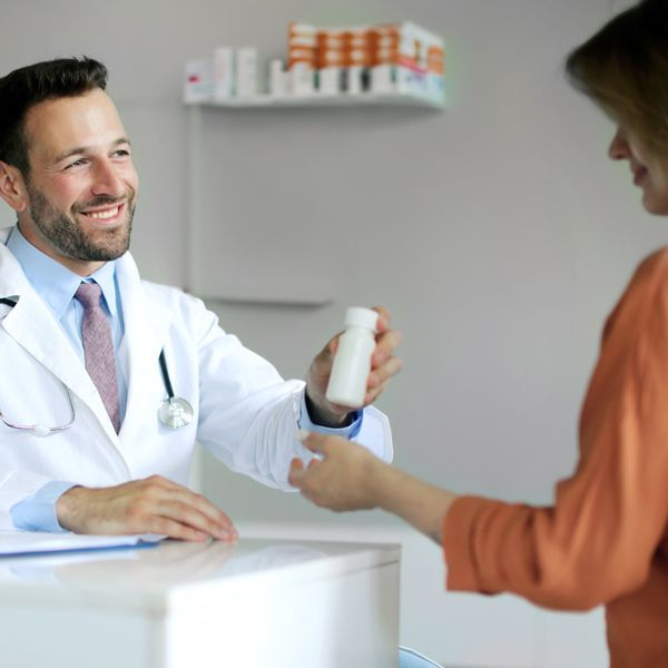 Medical doctor prescribing pills to anxiety patient