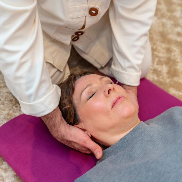 Practitioner Performing Fibromyalgia Energy Healing by Holistic Energy Bodyworks