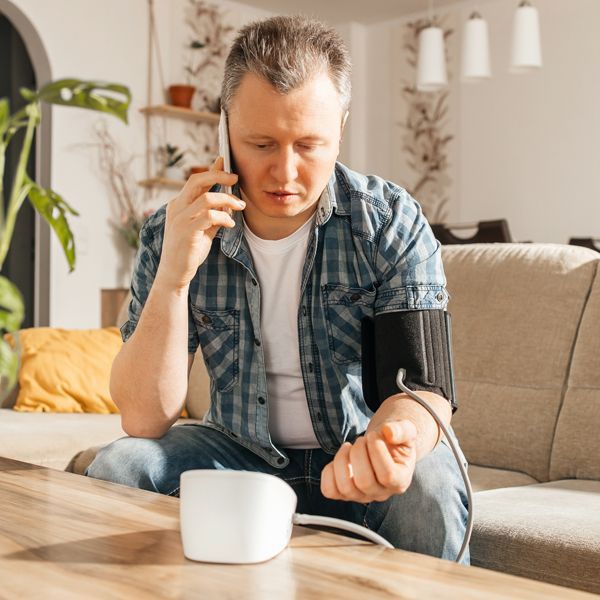 Man Contacting Holistic Energy Bodyworks for a Free Blood Pressure Management Consultation