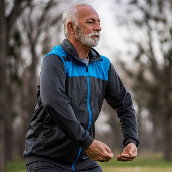 Man doing Qi Gong taught  Blood Pressure Management Energy Healing by Holistic Energy Bodyworks Practitioner