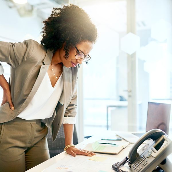 Woman Contacting Holistic Energy Bodyworks on speakerphone for a Free Consultation Regarding her Kidney Disorder