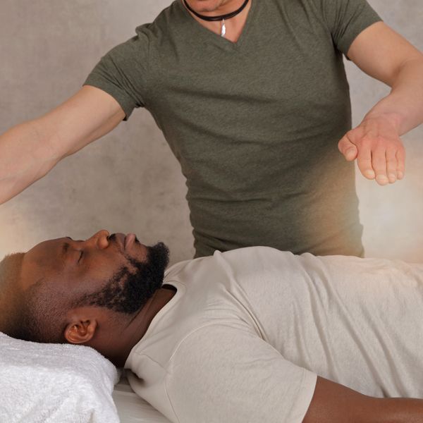 Man being treated for Anxiety Energy Healing by Holistic Energy Bodyworks.